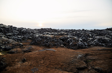 Fototapeta na wymiar Iceland volcanic landscape. Solidified volcanic lava. Sunset