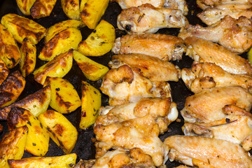 chicken wings with potatoes in the oven