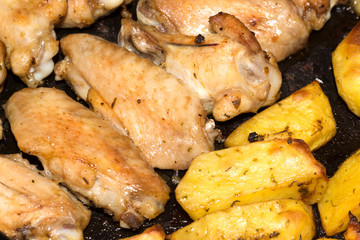 chicken wings with potatoes in the oven