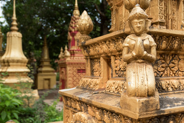 detail of decorative ornaments of golden stupa in buddhist temple in cambodia