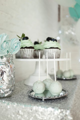  Delicious sweet cup-сakes for the holiday. Cakes with creamy green cream and fresh berries