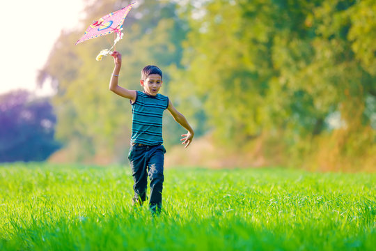 Indian Child Playing With Kite