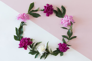 Flower wreath frame made of different flowers and leaves, flat lay, top view. Holiday background