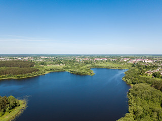 Fototapeta na wymiar Beautiful aerial view of lake and forest district. Belarus is th