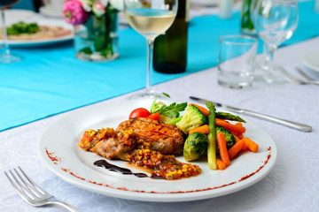 steak tuna with vegetables on served table in restaurant