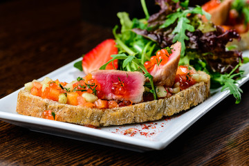 Delicious dish. Fresh bread with juicy meat slices served with c