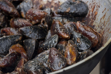 Grilled  mussels with herbs.Delicious  street food