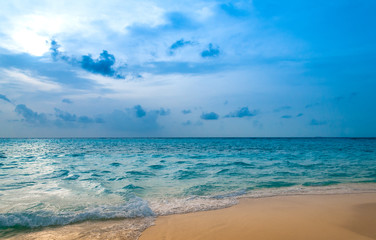 Indian Ocean. Tropical paradise. Turquoise water, blue sky and gold sand