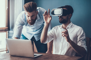 Young Businessmen Working with Gadgets in Office.