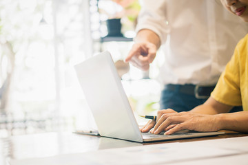 Fototapeta premium Start up partners are working in casual clothes, discussing the ideas for new strategy of development.