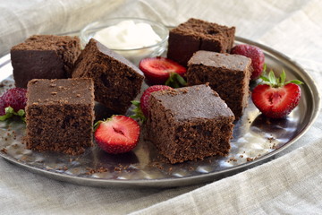 Chocolate sponge cake with strawberries and cream