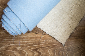 A piece of beige carpet without overlock
