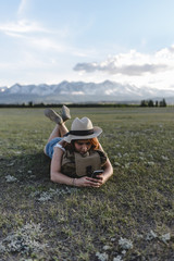 girl laying on the grass