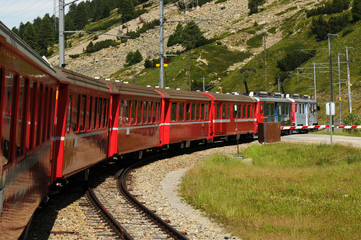 Naklejka premium The famous swiss mountain red train Bernina Express from Tirano to St.Moritz during summer season