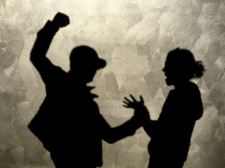 Aggressive man hitting innocent woman in the street