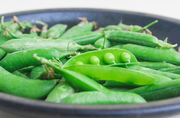 Ripe peas in bowl. Candid.