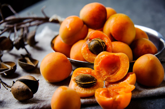Apricots in a metal pial are stacked
