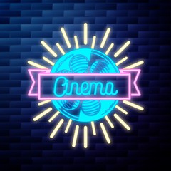 Vintage cinema emblem glowing neon sign