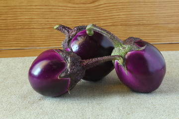 Whole fresh eggplant or aubergine bringal in wooden background