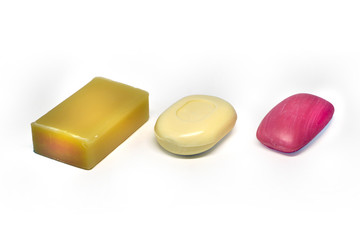 several pieces of soap on white background