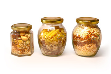 beautiful glass jars with cereal, cereals, pasta on white background