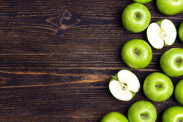 Ripe green apples on wooden background. Place for text.