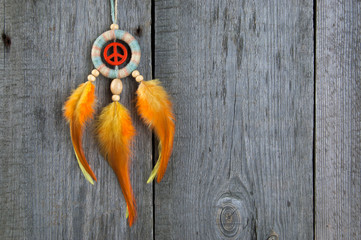 Bright dream catcher with an orange peace sign