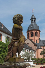 Fototapeta na wymiar Putto in the monastery garden of the church of St. Marcellinus and Peter in Seligenstadt, Germany