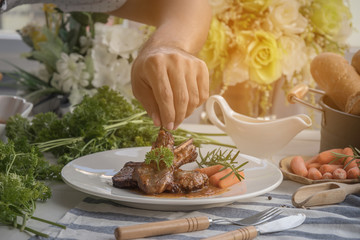 lamb steak on white plate