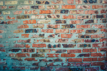 Background of old vintage dirty brick wall with peeling plaster, texture