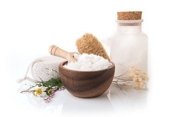 Spa arrangement with sea salt and bathing brush on white