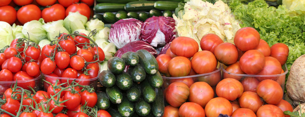fresh tomatos and other vegetables for sale at local market