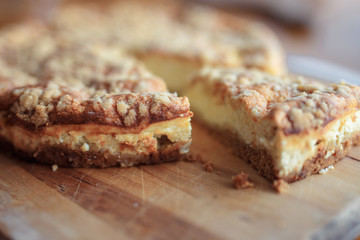 homemade cheesecake on a wooden cutting board