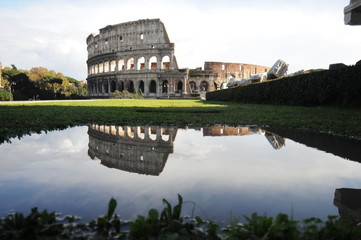 Colosseum in rome reflected in the water
