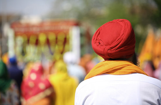 Sikh man with red turban outdoors