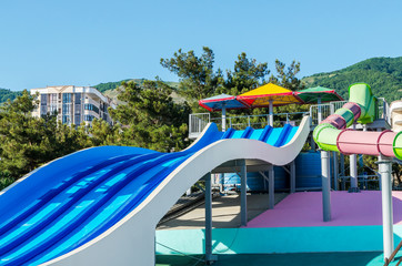 Fototapeta na wymiar Colorful water slides at the water park