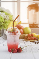 Strawberry italian soda arranged on wood table