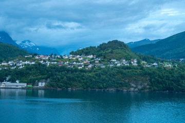 Fototapeta premium little village in the fjords of norway geiranger early in the morning