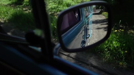 Blue retro bus driving in a city