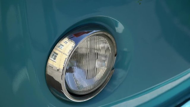 Headlight lamp of blue retro bus