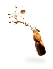 Coffee splash from a plastic bottle isolated on white background