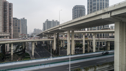 Aerial view of highway and overpass in city on a cloudy day