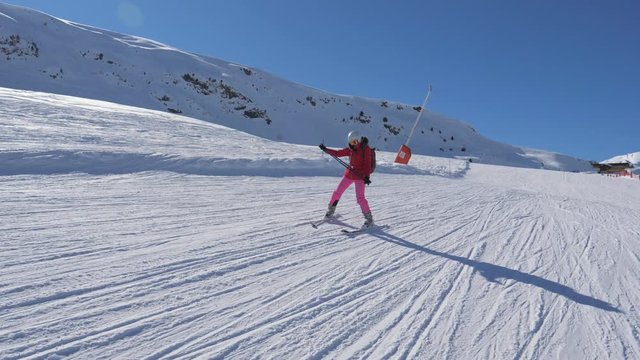 Beginner Skier Skiing Down The Mountain Slope And Learns To Turn Skis