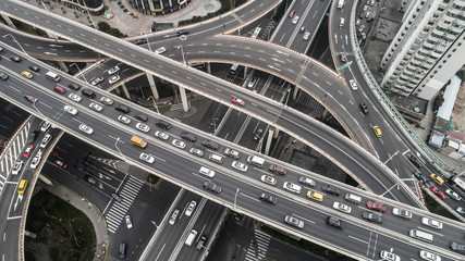 Aerial view of highway and overpass in city on a cloudy day