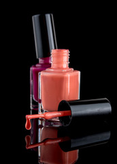 Nail polish bottle isolated on black background