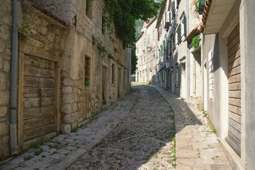 Obraz premium Ancient cobblestone street. Montenegro, town of Risan, Gabela street, this is one of the oldest roads in Europe