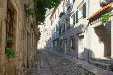 Fototapeta na wymiar Ancient cobblestone street. Montenegro, town of Risan, Gabela street