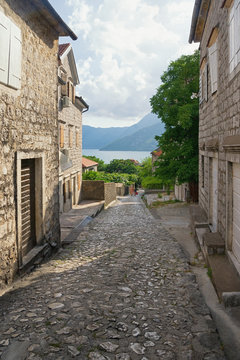 Narrow picturesque street descends to the sea. Montenegro, Bay of Kotor, town of Risan, Gabela street