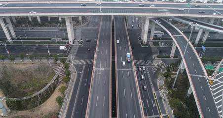 Fototapeta premium Aerial view of highway and overpass in city on a cloudy day