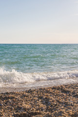The sea shore at summer Sunny day just before sunset
